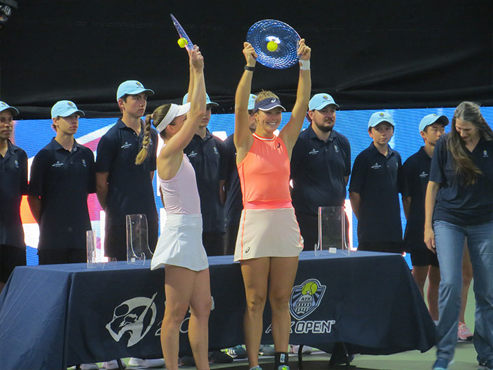 Olivia Nicholls and Olivia Gadecki raise their ATX Open trophies.