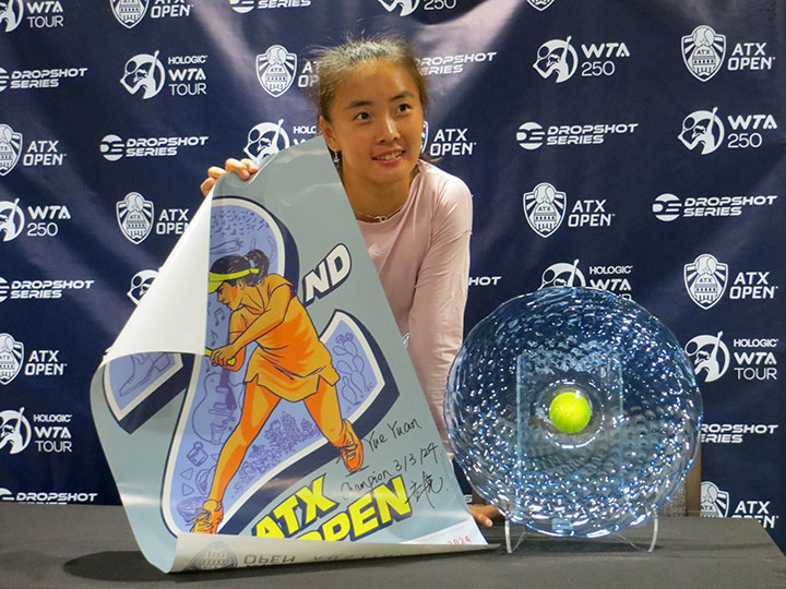 Yuan Yue poses with the champion's trophy and an autographed poster after winning the 2024 ATX Open.