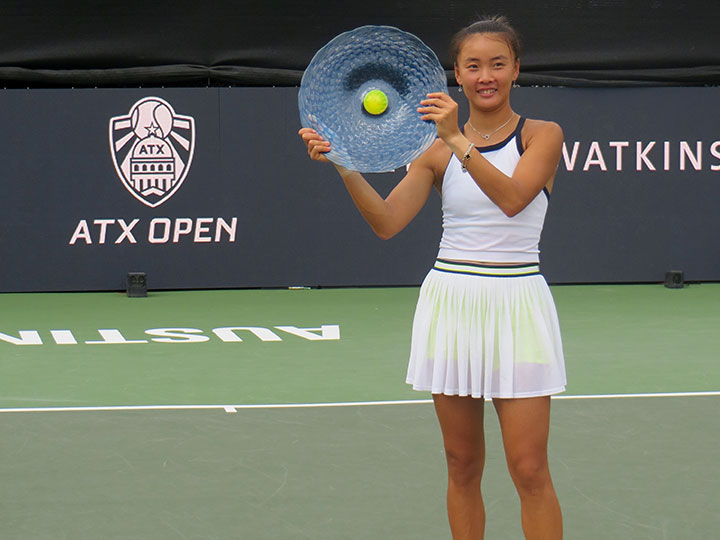 Yuan Yue poses on the court with her ATX Open trophy.