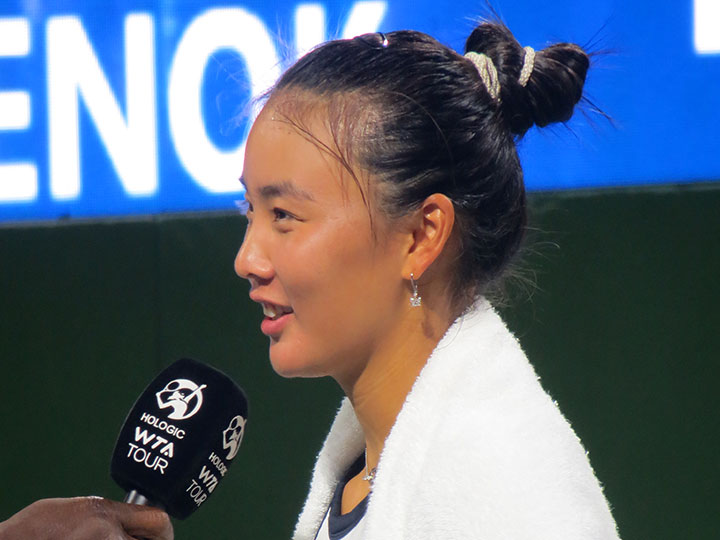 Champion Yuan Yue speaks on court after her semifinal victory over Anna Karolína Schmiedlová.
